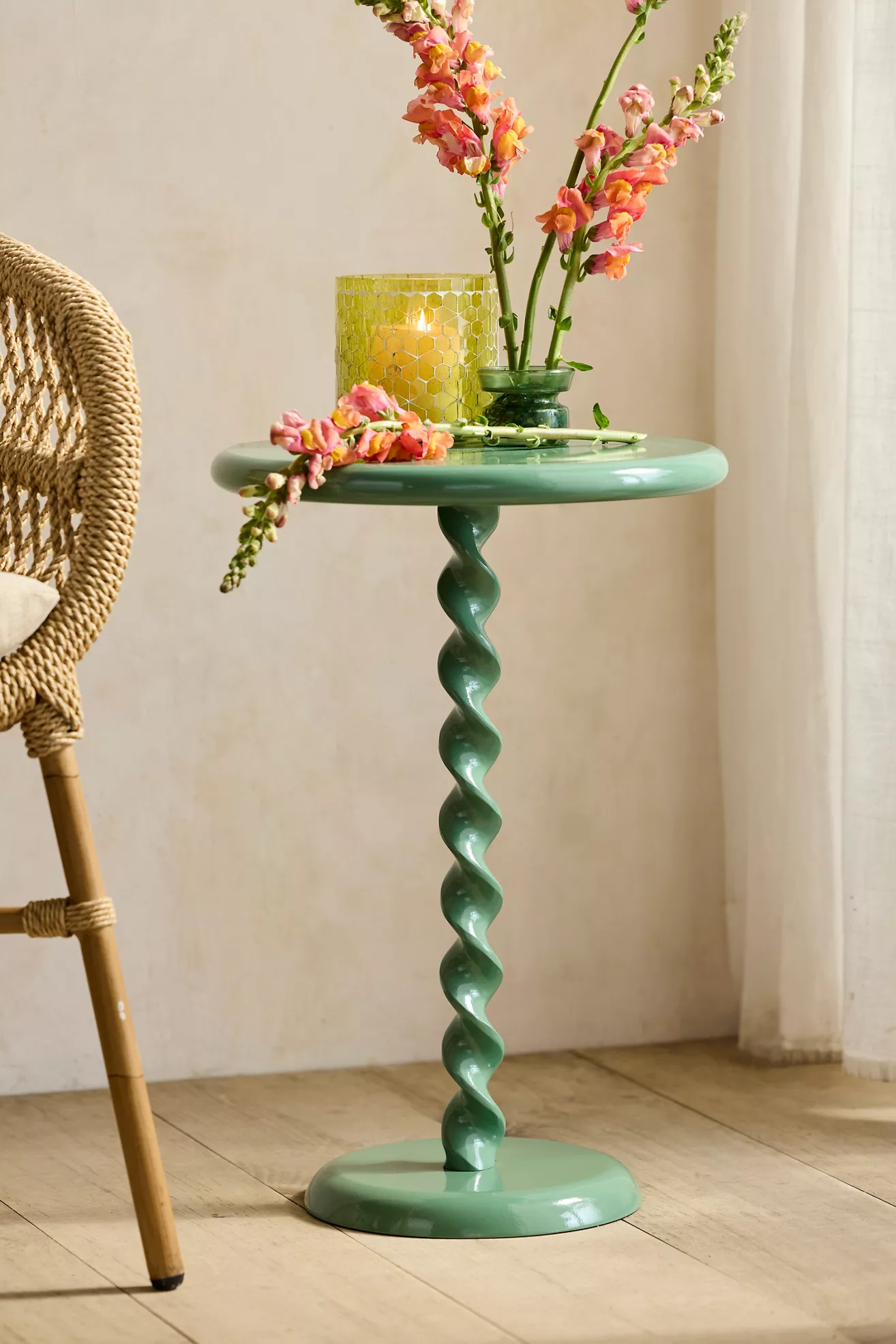 Close-up of spiral side table with flowers