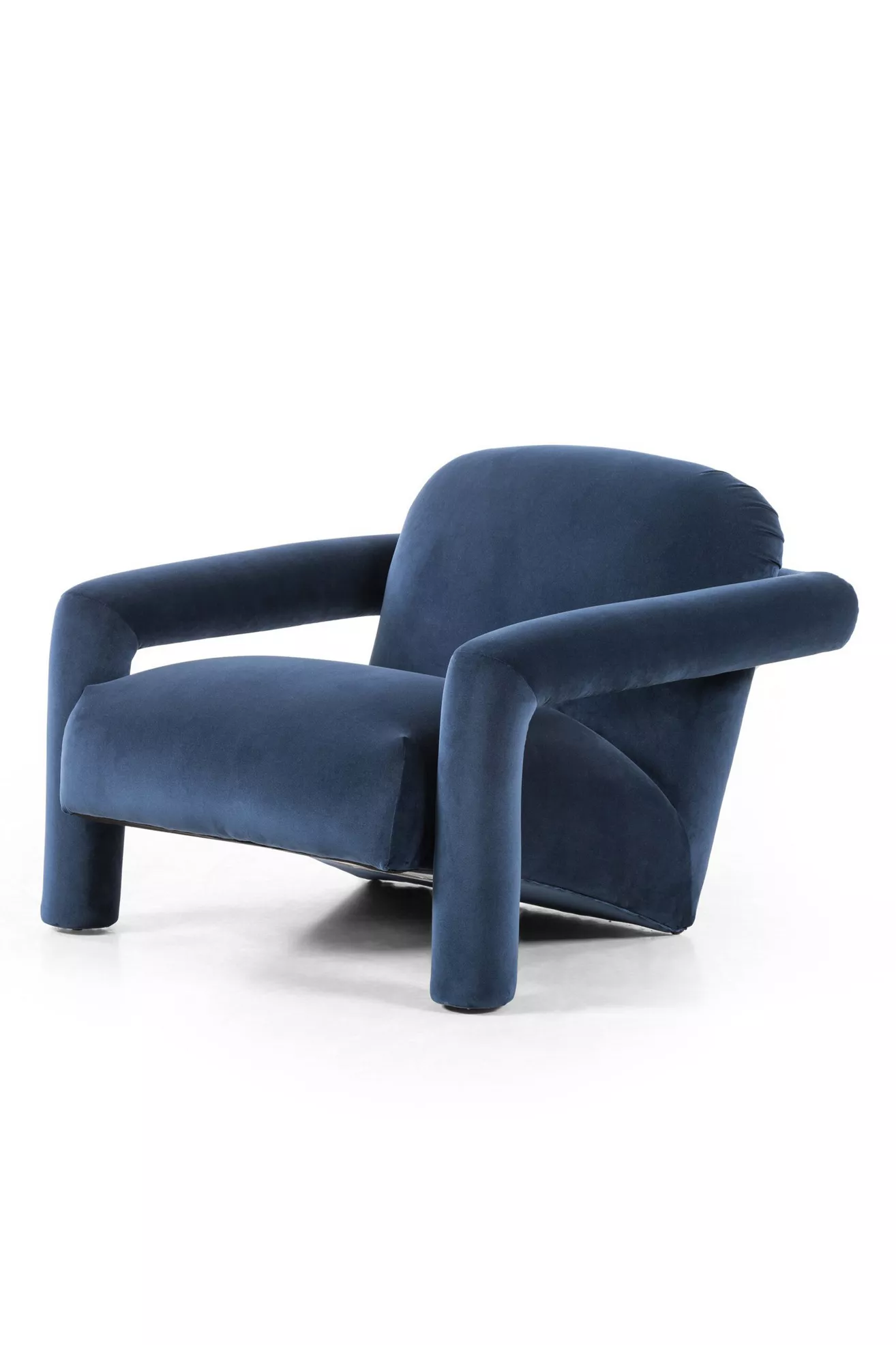 three-quarter view of blue velvet chair