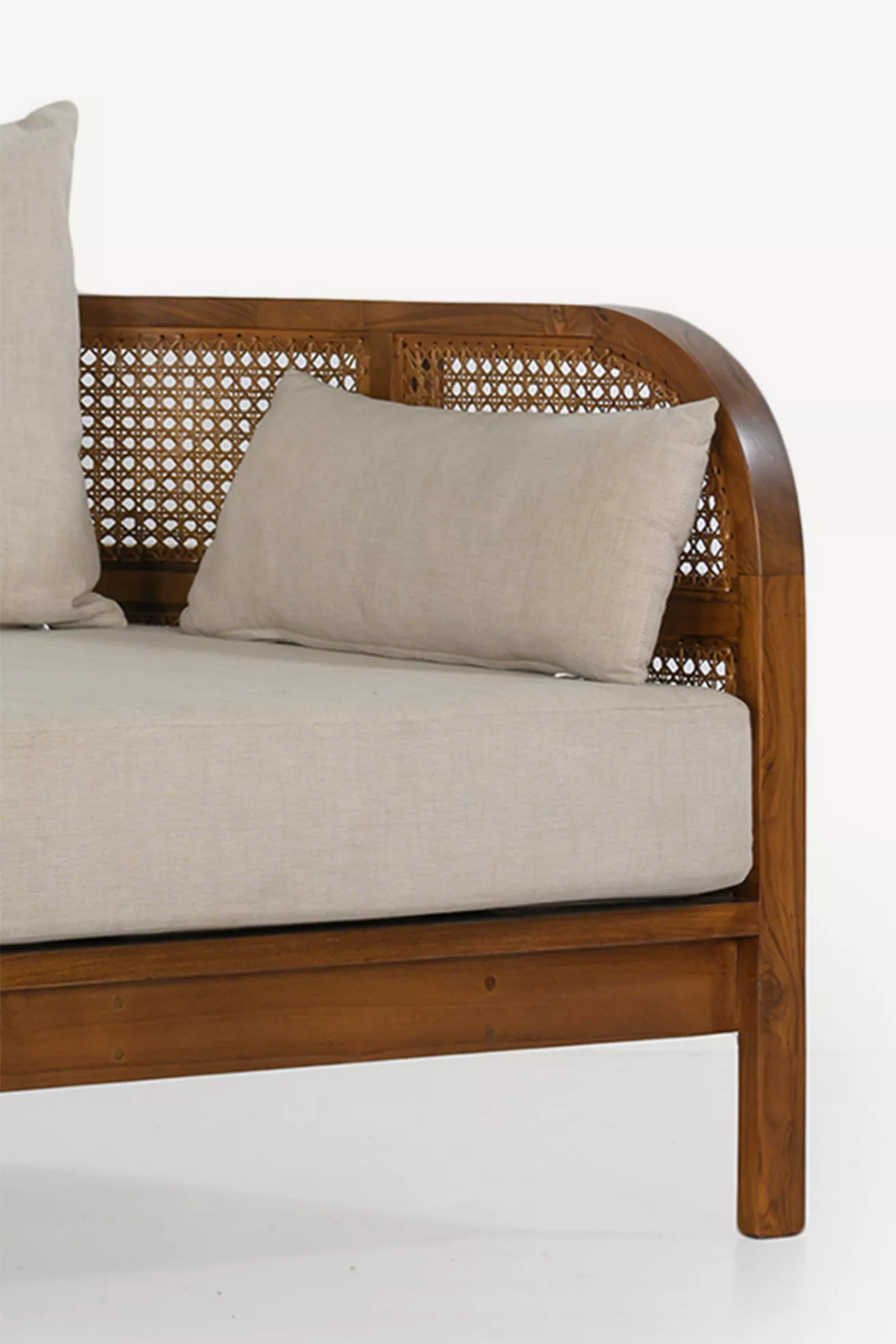 Close-up of caned panel and curved wood of Nest 82" Linen Daybed