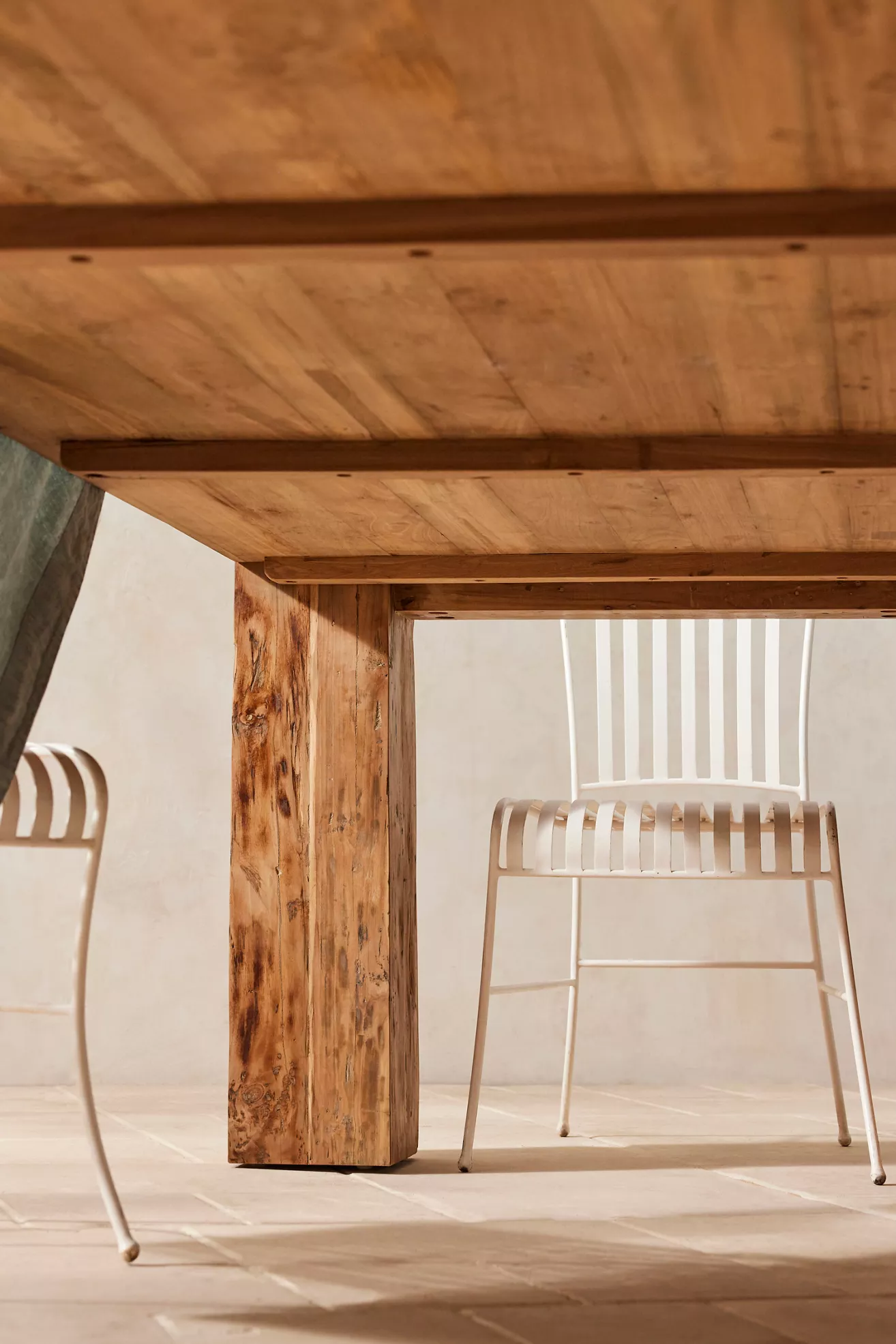 Under-table view with chairs in background