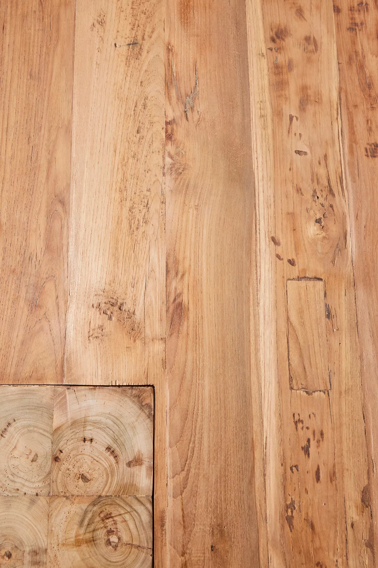 Wooden table surface close-up showing grain and knots