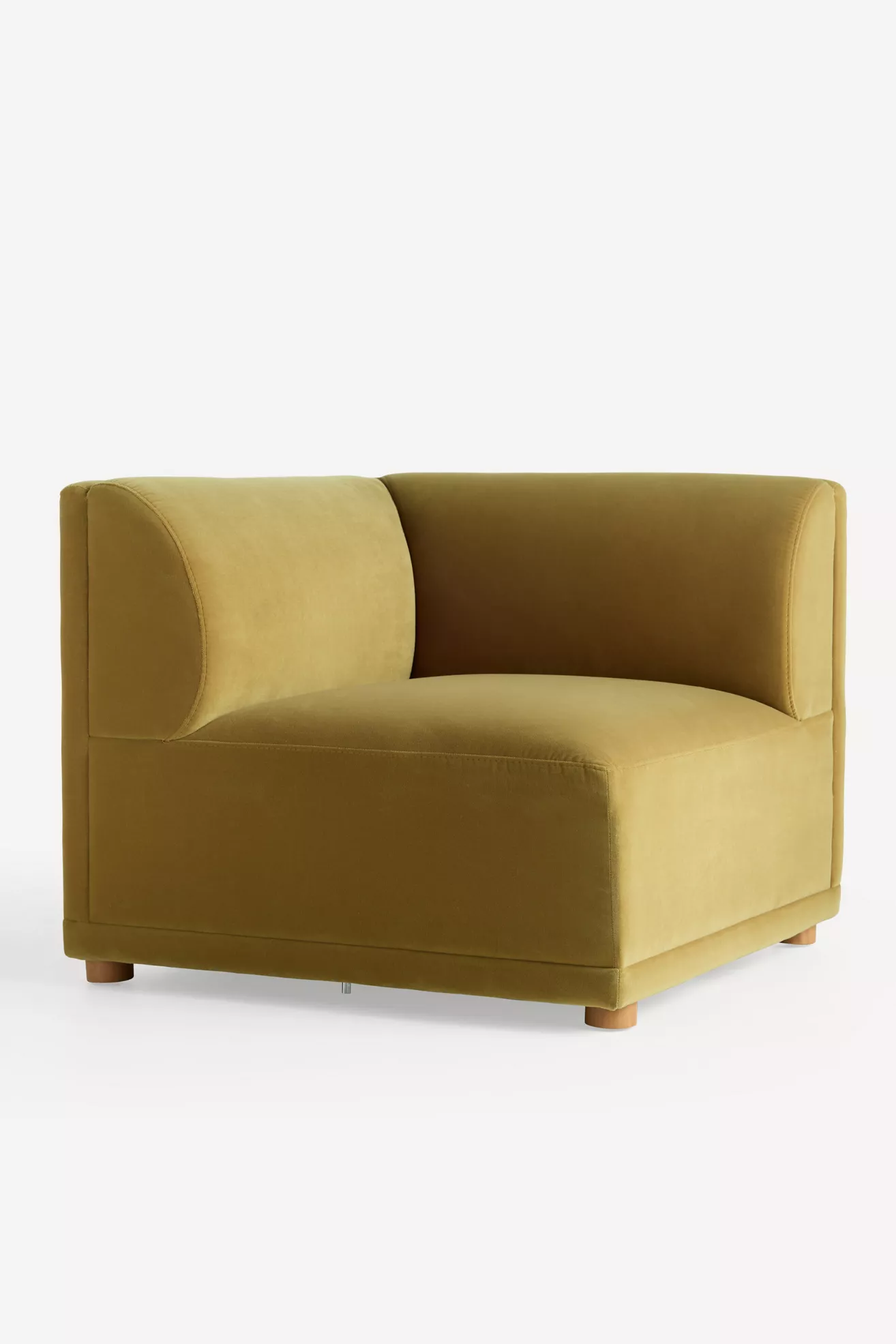 Three-quarter view of mustard velvet modular chair