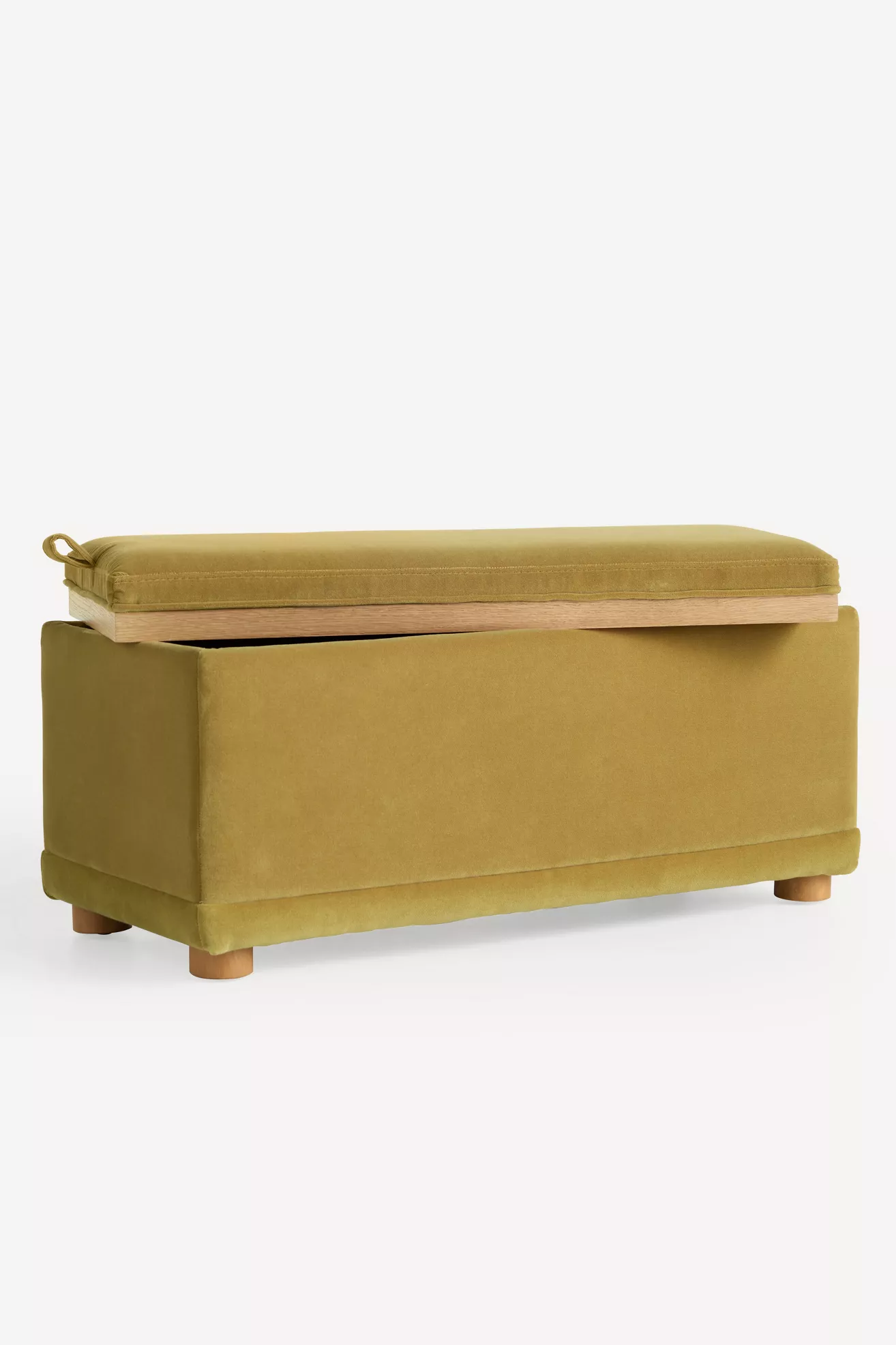Open lid showing interior storage space of the mustard velvet ottoman