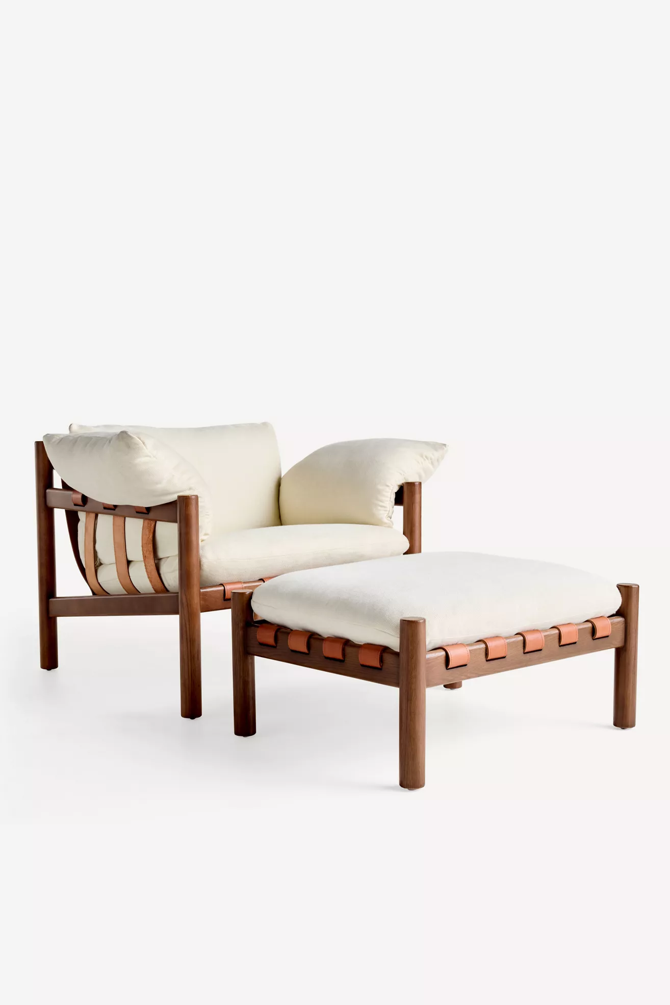 Two-piece set: chair and matching ottoman with leather strap detailing