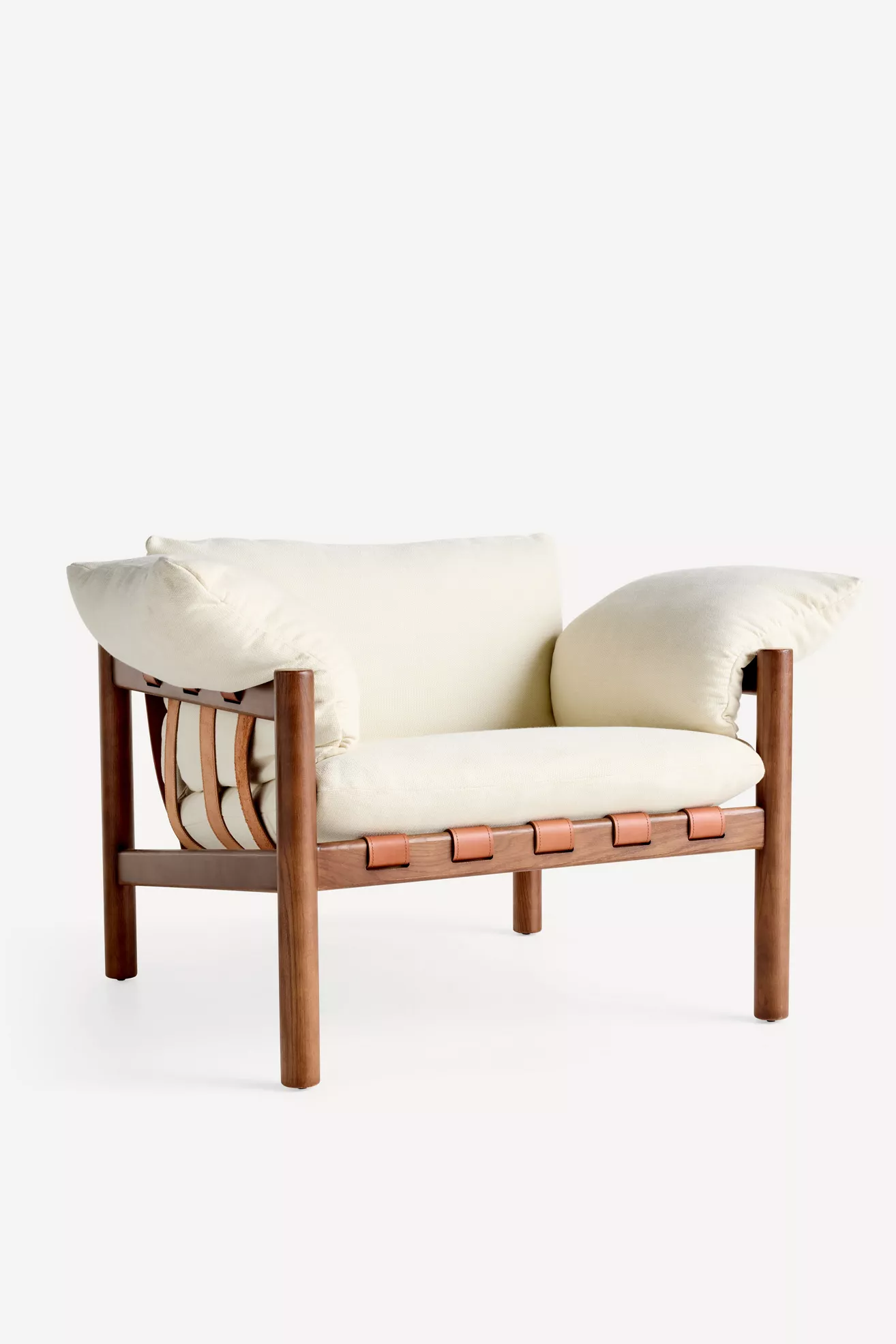 Back view of cream cushioned lounge chair showing leather strap details