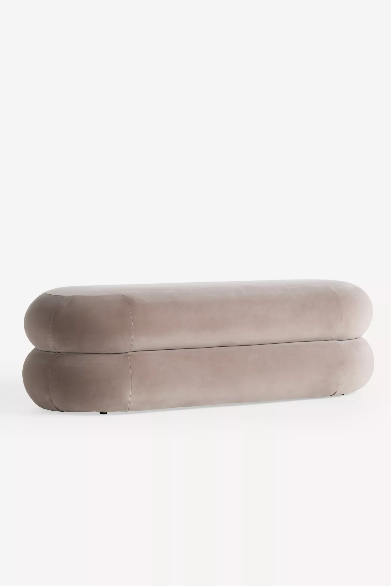 Close-up of rounded corner and seam on taupe velvet bench