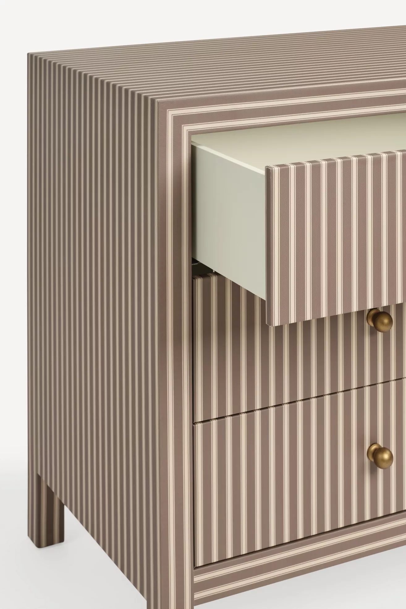 Close-up angle of Hale canvas six-drawer dresser with vertical striped drawers and brass knobs