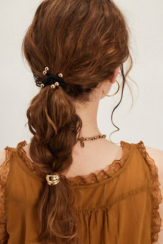 Mini Poney Molly par Free People en Gold, pour femme