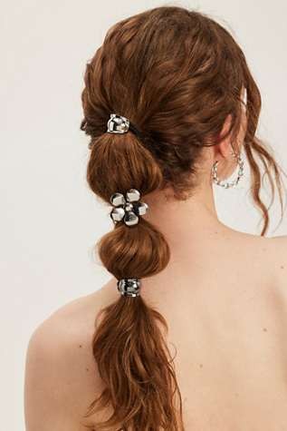 Flora Pony at Free People in Silver Daisy