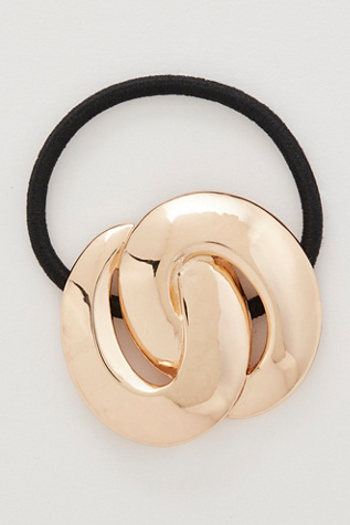 Round Out Pony at Free People in Gold