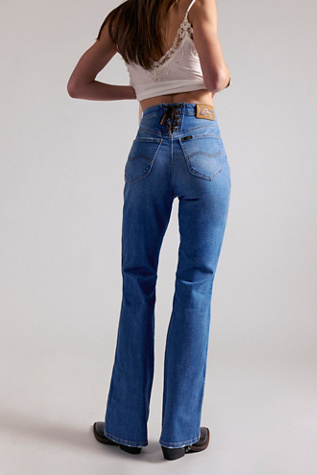 Lee Lace-Up High-Rise Bootcut Jeans at Free People in Medium Wash, Size: 28