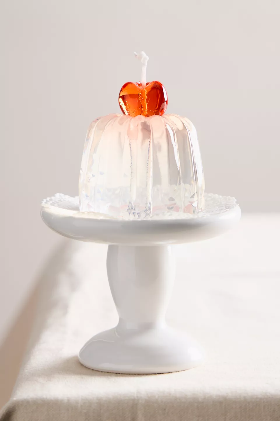 Jello Candle in ivory on a nightstand