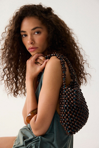 Reynaldo Wood Bead Bag by Levens Bags at Free People in Brown