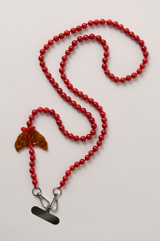 Solar Eclipse Crossbody Phone Chain at Free People in Bow Croissant