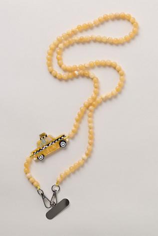 Solar Eclipse Crossbody Phone Chain at Free People in Yellow