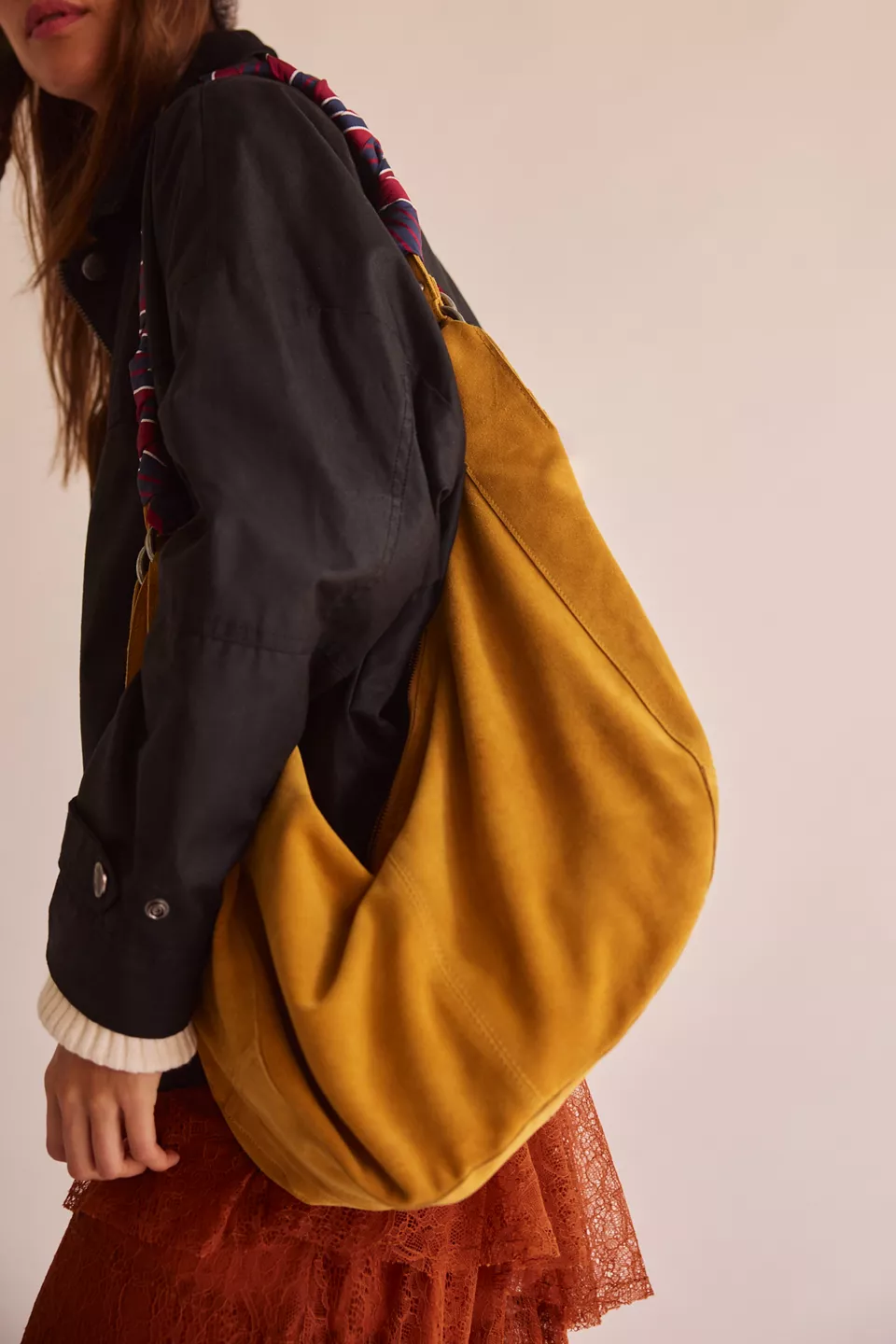 A person carrying a yellow bag