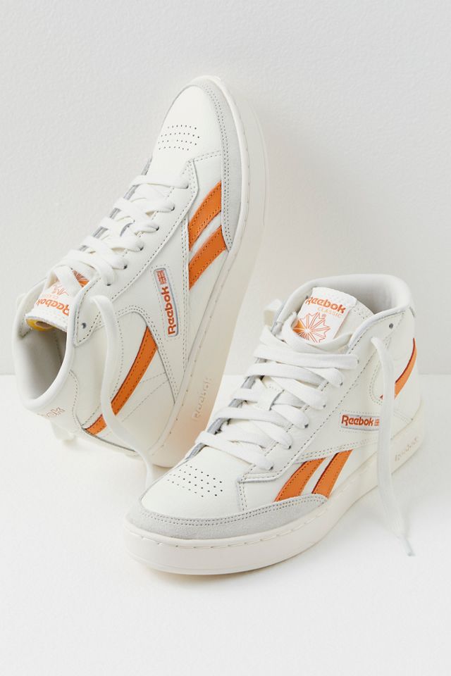 Orange high top reeboks best sale