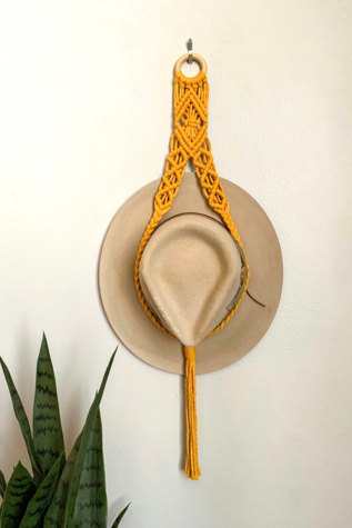 I Would Rather Knot Macrame Hat Hanger at Free People in Yellow