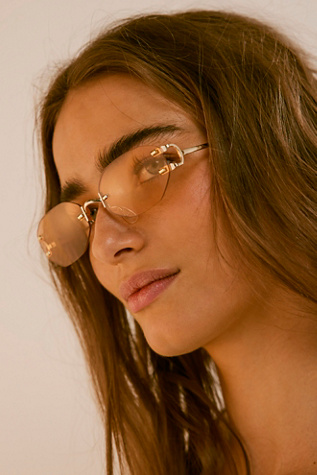 Kai Rimless Slim Sunnies at Free People in Peach Pit