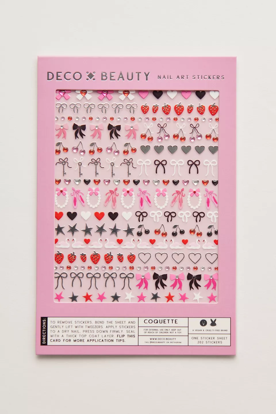 Pink, black, and white nail stickers in a pink package