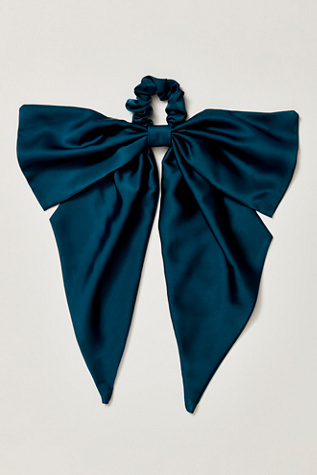 The Drama Bow Pony at Free People in Blue