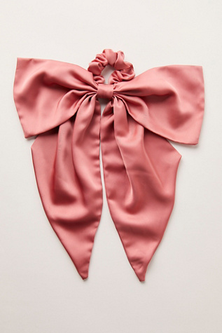 The Drama Bow Pony at Free People in Pink/Rose