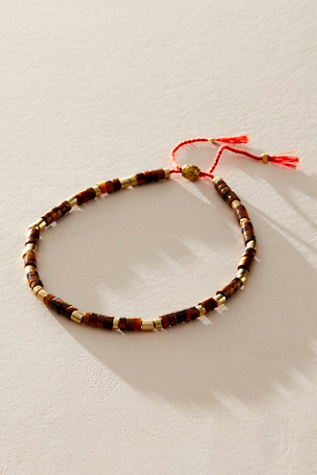 Sun Moon Rain Anklet at Free People in Tigers Eye