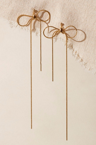 Extreme Bow Dangles at Free People in Gold