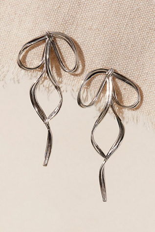 By Nubyen Pirouette Bow Earrings at Free People in Silver Bow