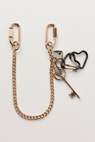 Charmed Swag Bag Charm at Free People in Shiny Gold