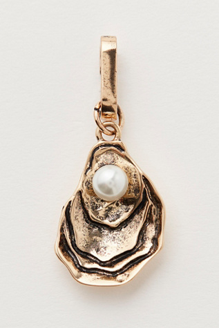 Oyster Bag Charm At Free People In Shiny Gold