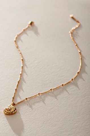 Collier coquillage TCB