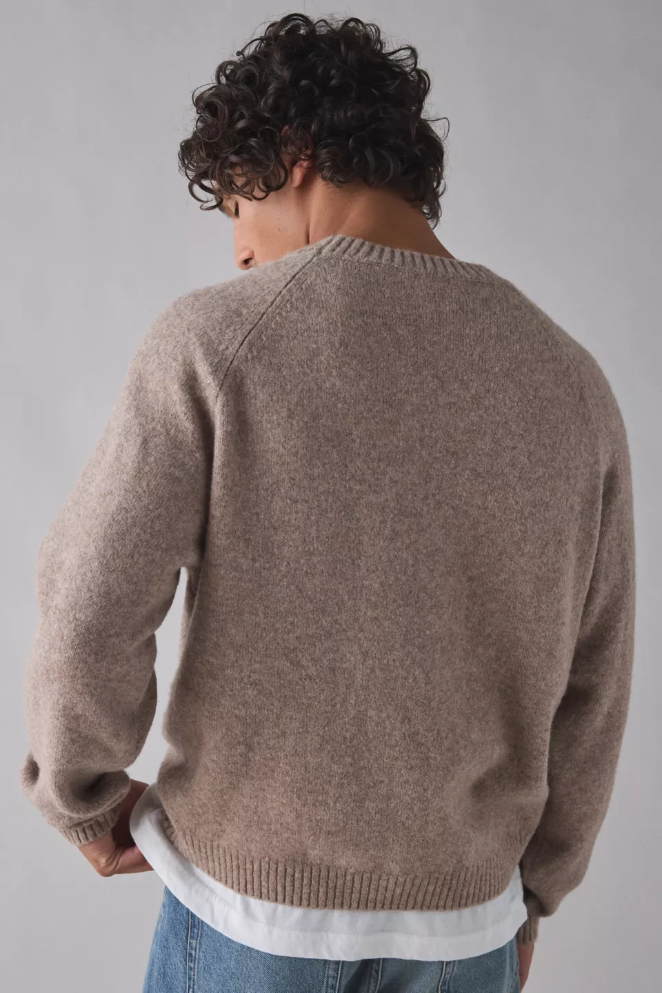 A man wearing a taupe sweater