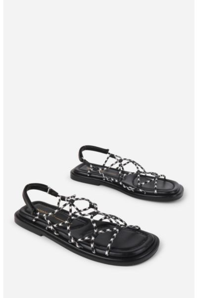 INTENTIONALLY BLANK LYCHEE ELASTIC SPORT CORD FLAT SANDAL IN BLACK WHITE, WOMEN'S AT URBAN OUTFITTERS 
