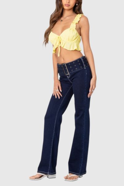 EDIKTED BUCKLE BELT WASHED FLARED JEANS IN INDIGO/BLUE/RAW, WOMEN'S AT URBAN OUTFITTERS 