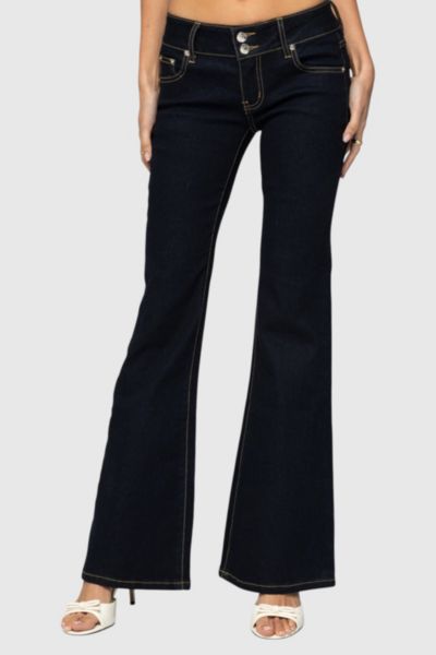 EDIKTED TILDA LOW RISE FLARED JEANS IN INDIGO/BLUE/RAW, WOMEN'S AT URBAN OUTFITTERS 