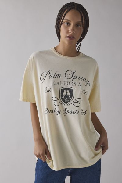 Urban Outfitters Palm Springs Prestige Sports Club Crest Crest Graphic Oversized T-shirt Dress In Yellow, Women's At 