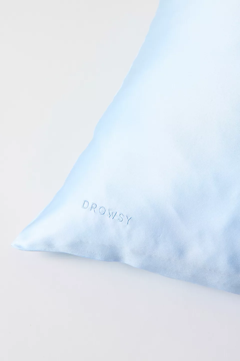 A blue pillowcase on a pillow