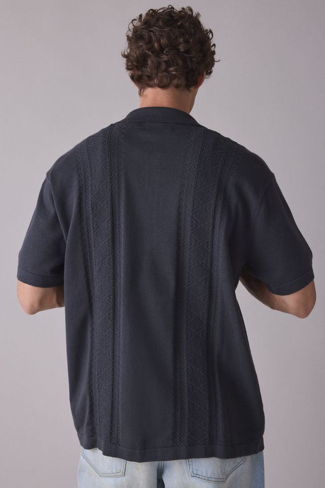 Chandail polo en tricot à manches courtes Trader de The Critical Slide Society #1