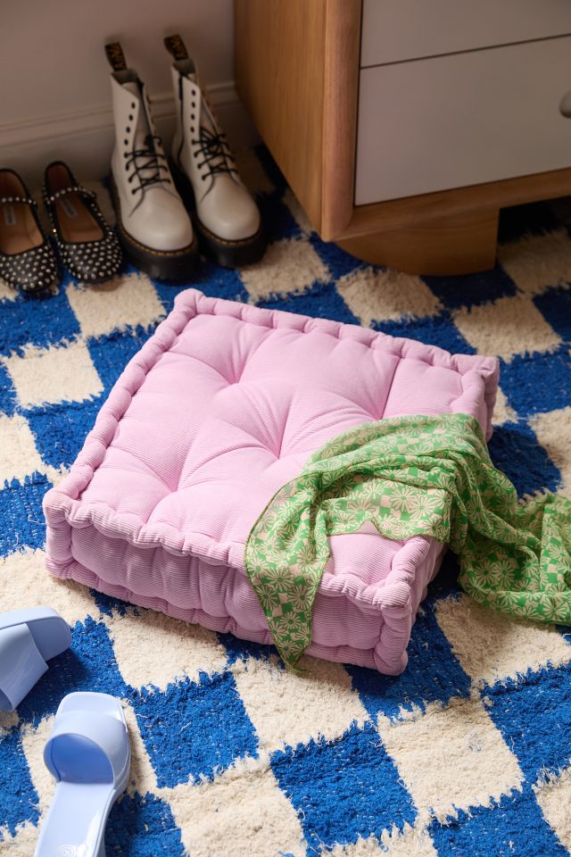 Pink floor outlet pillow