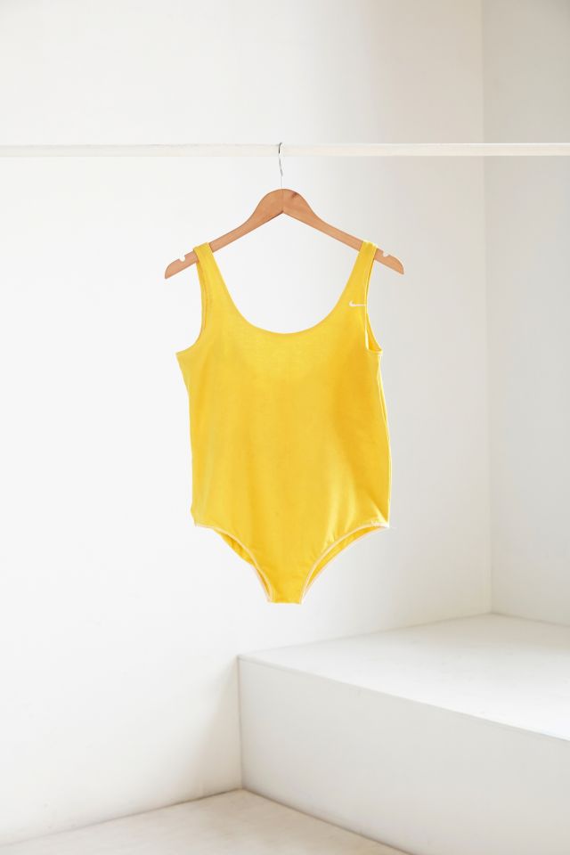 Nike yellow hot sale bodysuit