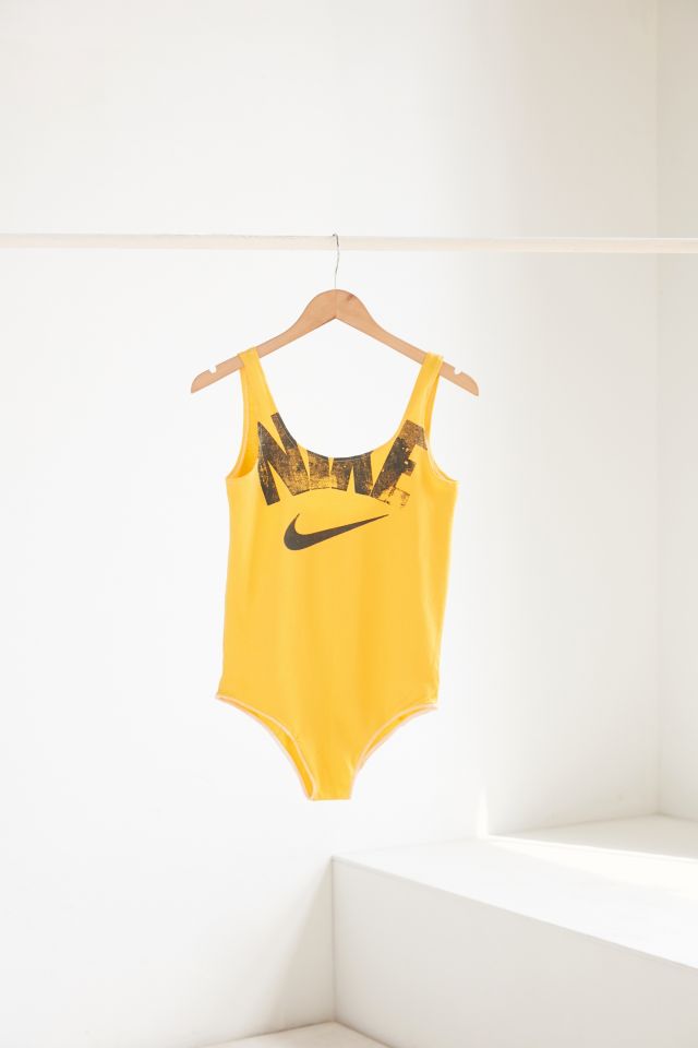 Nike store bodysuit yellow