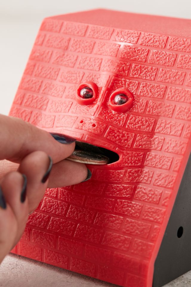 Banque en forme de visage qui mange la monnaie #1