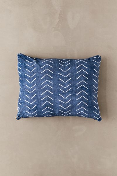 Blue dog bed with white arrow décor