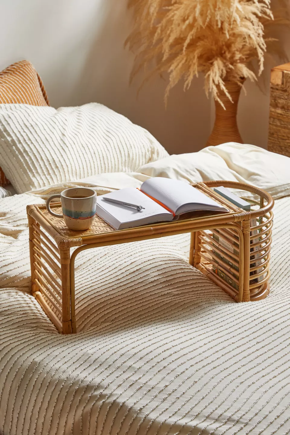 A rattan bed tray in a bed