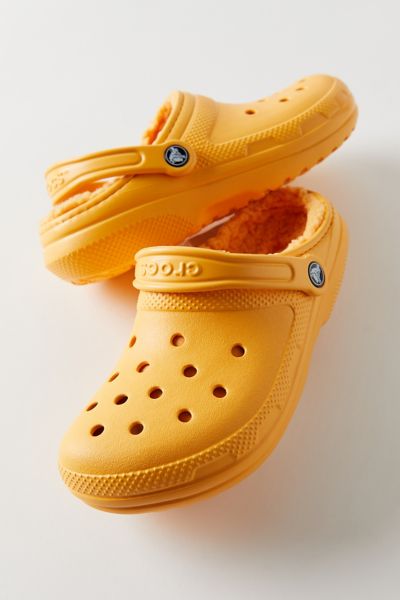 Orange crocs store with fur