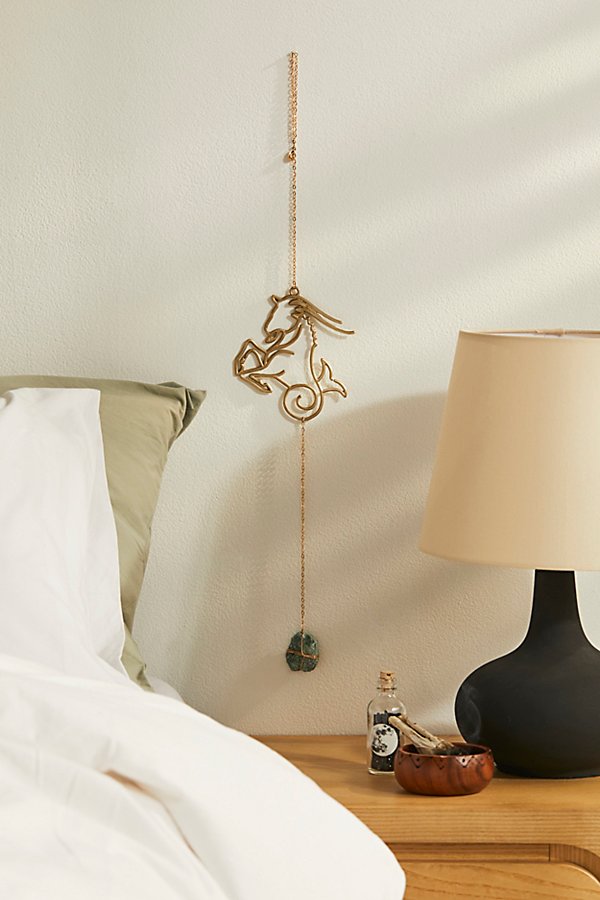 Ariana Ost Zodiac Wall Dangle In Capricorn At Urban Outfitters In Gold