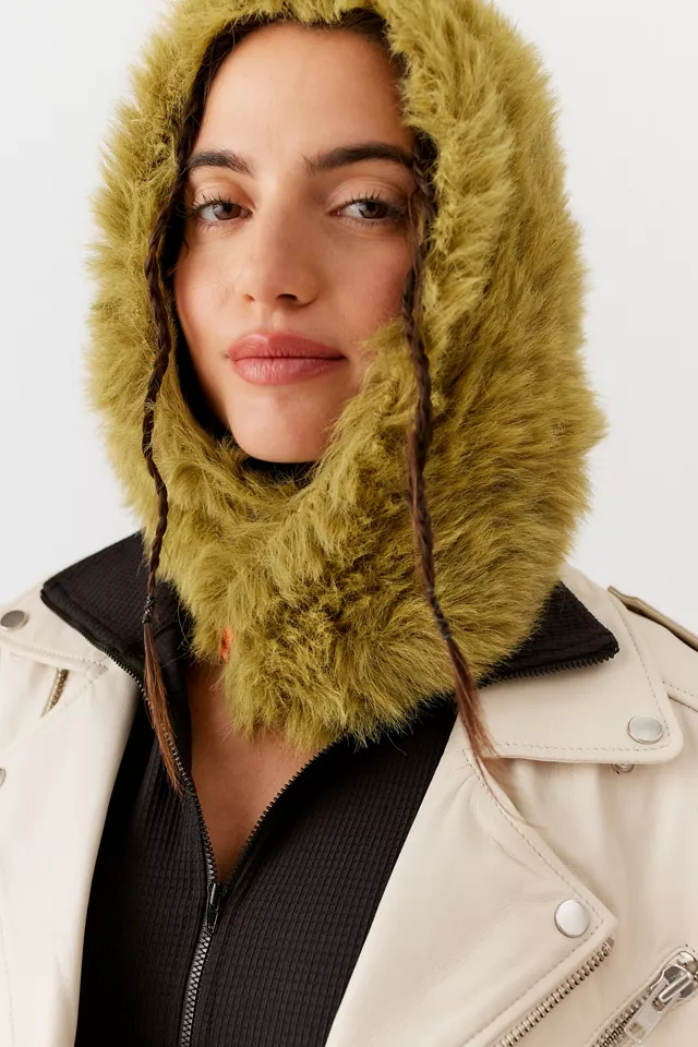 A Woman Wearing A Green Fuzzy Faux Fur Balaclava