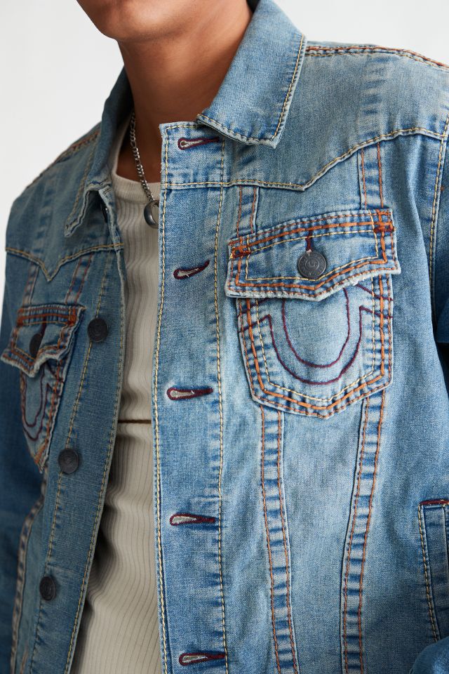 True Religion Brand Jeans - Finish your look with the Monogram Denim Jacket.  This trucker style jean jacket features an allover tonal monogram print and  classic, collared, button-front design. Finished with chrome