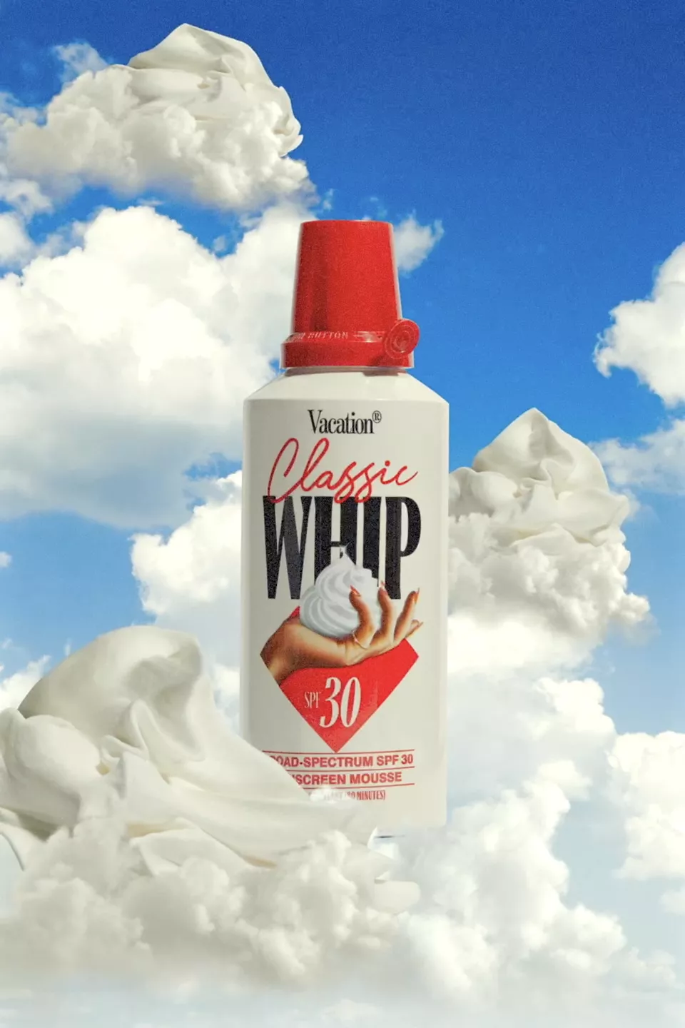 A red and white can of sunscreen in the clouds